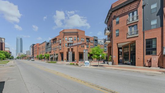 a street view of a city street with buildings at The Steelyard Apartments